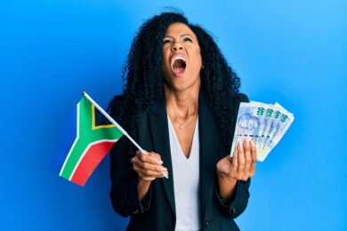 Middle,Age,African,American,Woman,Holding,South,African,Flag,And